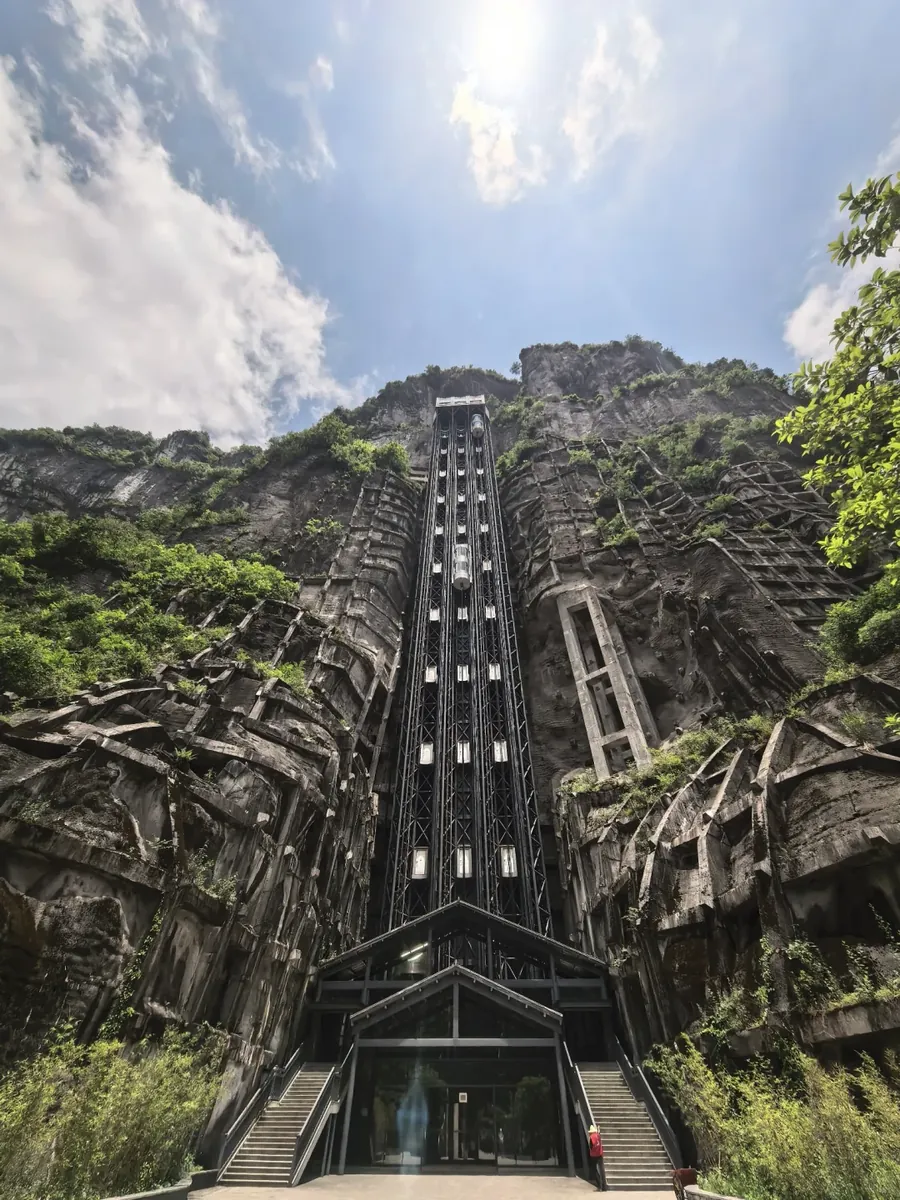 An 80-metre glass lift drops straight to the valley floor