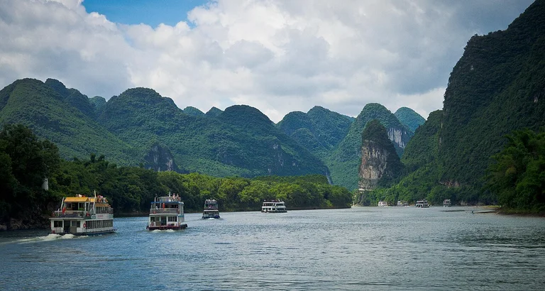 Cruise the Li River with top guides, unwind and soak up the grand river views