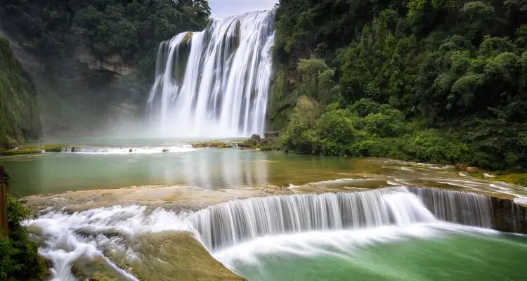 Visit one of Asia's largest waterfalls and step into Sun Wukong's Water Curtain Cave