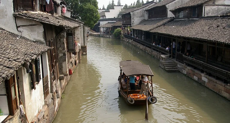 Explore the tranquil canals and rich opera culture of a traditional water town