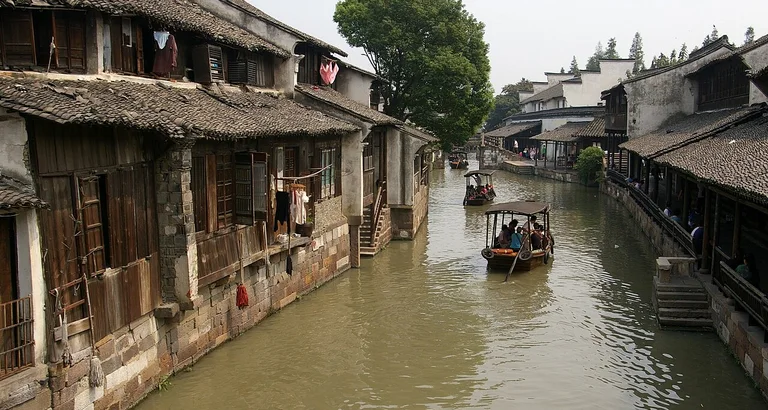 Explore the tranquil canals and rich opera culture of a traditional water town